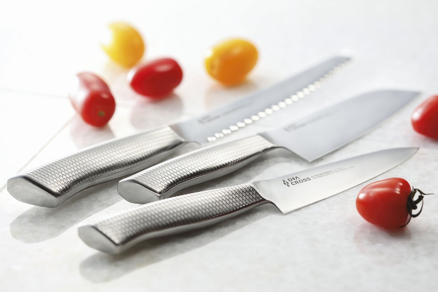 DiaCross knives made by Sumikama Cutlery in Japan (Kasumi Knives). Blades are Molybdenium Vanadium steel and handles are 18/8 stianless steel. Designed with the Diamond cross on the handles for better grip.